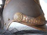 a close up of a helmet on top of a horse ' s head
