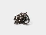 a close up of a ring on a white surface with a white background