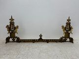 pair of antique brass candlesticks on a white background