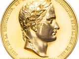 pièce d'or représentant le portrait d'un homme coiffé d'une couronne