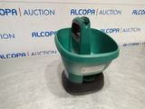 a close up of a green bucket with a phone in it
