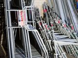 a lot of chairs that are stacked up in a room