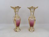 pair of pink and gold vases on a white background