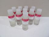 six bottles of hand sanitizer sitting on a white surface