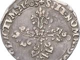 a close up of a silver coin on a white background