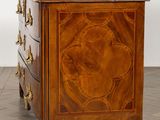 an image of a wooden chest of drawers sitting on top of a hard wood floor