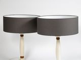 two lamps with black shades and a white base