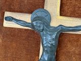a statue of a man on a cross on the wall