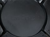 the back of a black leather backpack with a black logo on it
