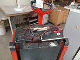 a red machine that is sitting on top of a table