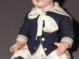 a small doll that is sitting on the floor