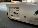 a white box with a power cord plugged into it