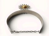 a silver bracelet with a flower on top of it