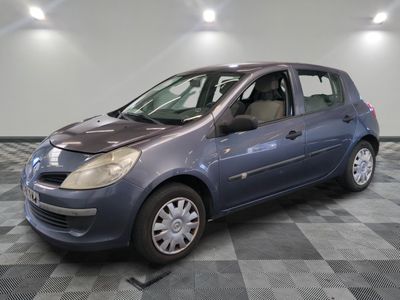 a picture of a blue car parked in a garage