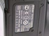 a close up of the battery compartment of a digital camera