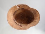 a brown hat that is hanging from the ceiling