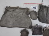 a bag and a pair of shoes and a purse on a table