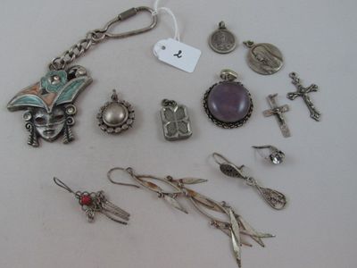 a lot of jewelry that is laying out on the table