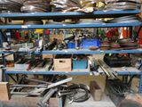 many different types of wheels on the shelves in the shop