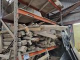 a large pile of wood sitting on a pallet in a warehouse
