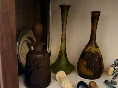 many different vases sitting on a shelf next to each other