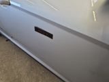 a close up of a car door with a sticker on it