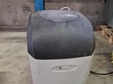 a suitcase that is sitting on the floor in the garage