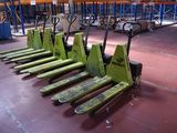 many pallets that are sitting on the floor in the warehouse