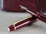 two pens sitting next to each other on a table