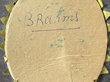 a piece of cardboard with writing on it on the floor