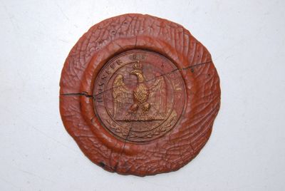 a brown plate with a picture of a bird on it