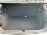 a trunk of a car with the back seat folded down