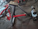 an image of a gym room with a bench and exercise equipment