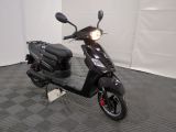 a scooter that is parked in a room