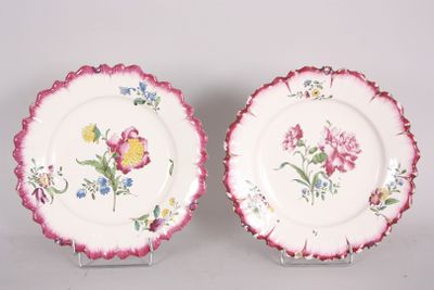 pair of pink and white plates with floral designs on them