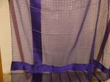 a blue and purple scarf hanging on a rack
