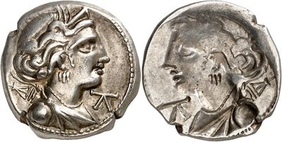 a silver coin with an image of a man and a woman on it