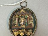 a small locke with a picture on it hanging from a string