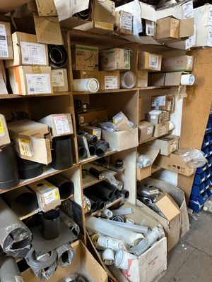 a lot of boxes and other items on the shelves