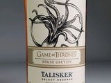 a bottle of whiskey with an octopus on the label