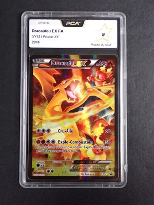 a close up of a pokemon card in a plastic case