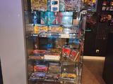 a glass display case with a lot of games on it