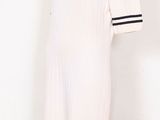 an image of a mannequin wearing a dress with buttons on it