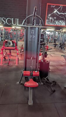 a gym with a lot of machines in the room