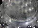 a close up of a glass object with a lot of holes in it