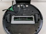 an image of a robotic vacuum cleaner sitting on top of a counter