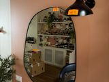 a bathroom with a sink and a mirror on the wall