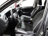 the interior of a car with black leather seats and a steering wheel