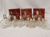 six bottles of perfume sitting next to each other on a white surface