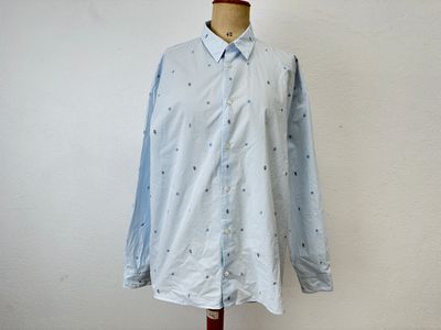 an image of a dress shirt on a mannequin stand